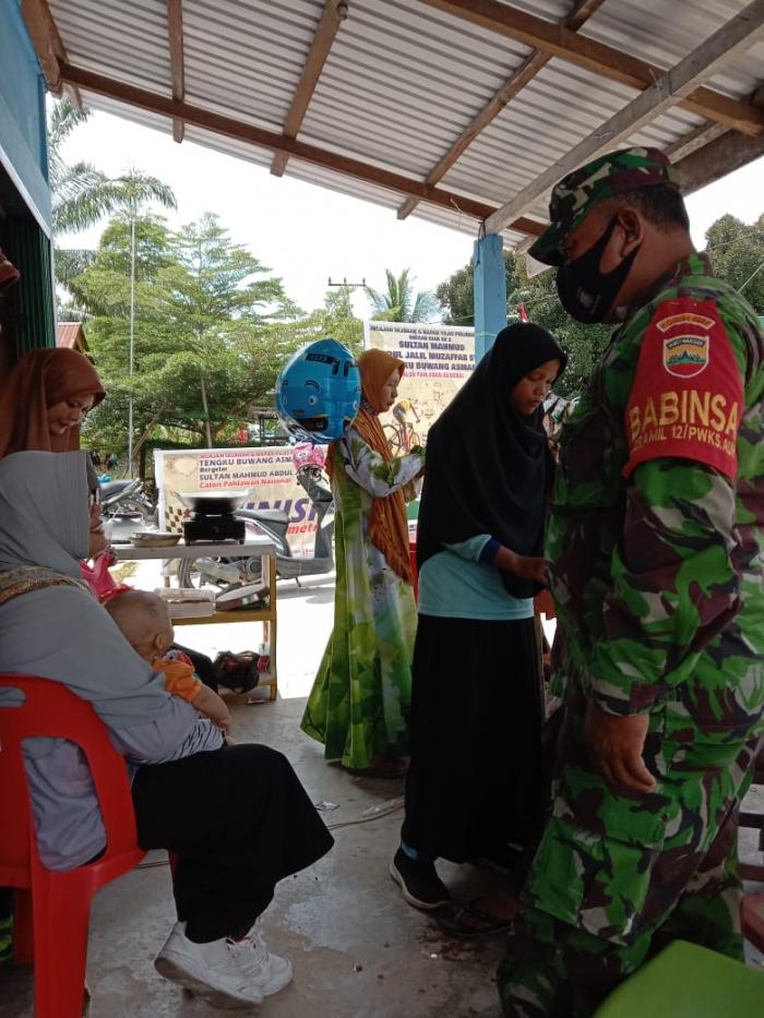 Putus Covid 19, Sertu Khairul Bakti Giat Lakukan Prokes Di Desa Belading 