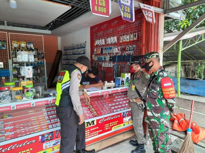 Anggota Danramil 09/Minas Kembali gelar gakplin protokol kesehatan.